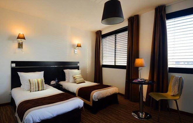appart-hotel-odalys-ferney-geneve-1lieu1salle-chambre-twin.jpg